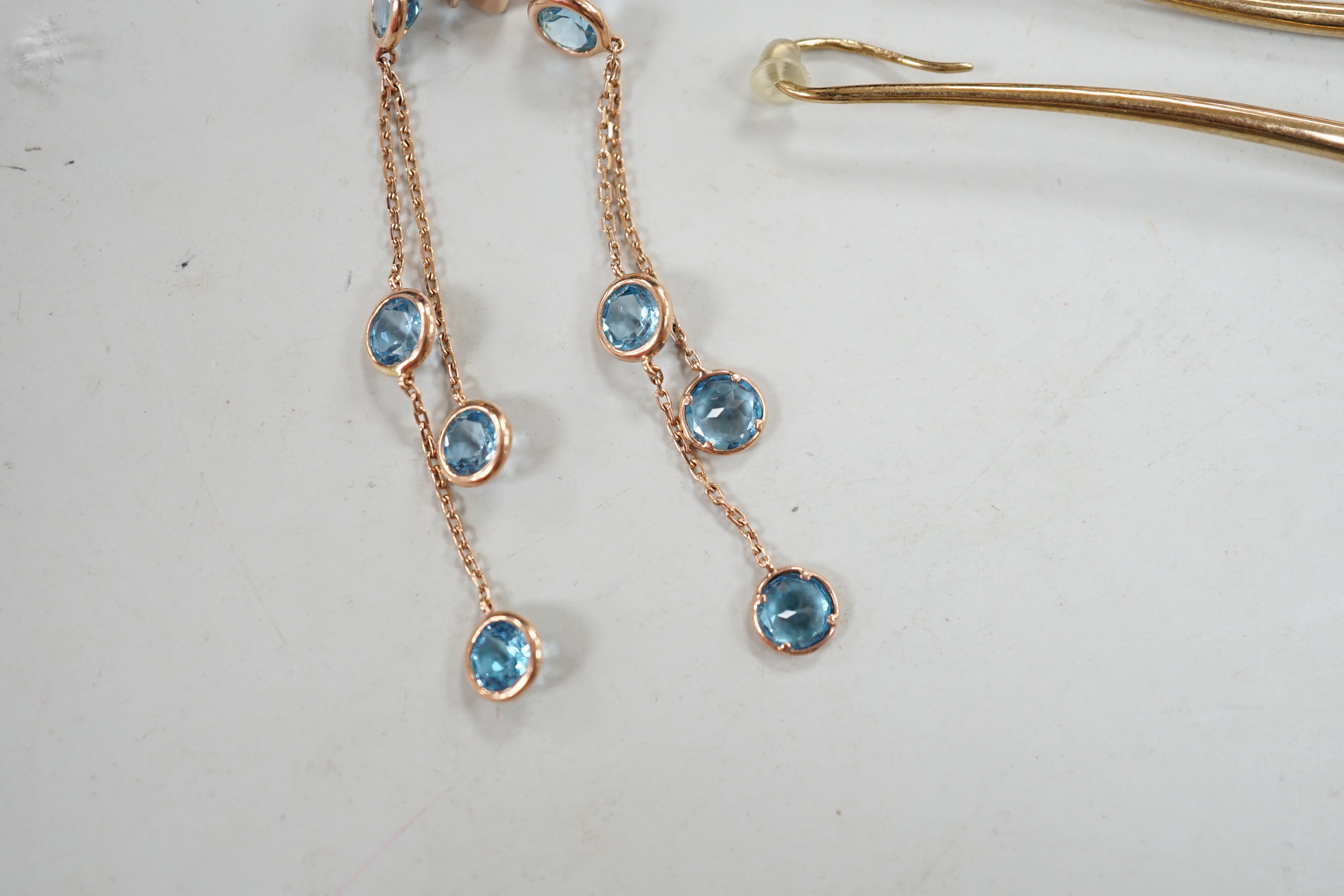 A modern pair of 9ct gold and single stone diamond set elongated earrings, overall 58mm, a similar pair of 9ct tassel drop earrings, three other pairs of assorted 9ct and gem set earrings and a pair of yellow metal and g